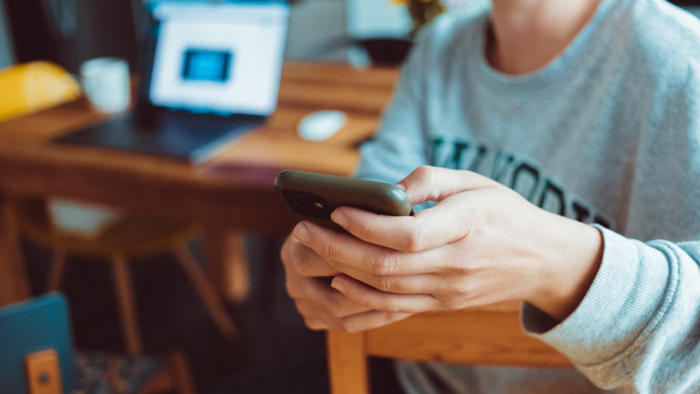 a person using her mobile sports app