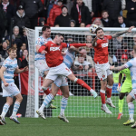 Charlton Athletic players competing in a Championship match