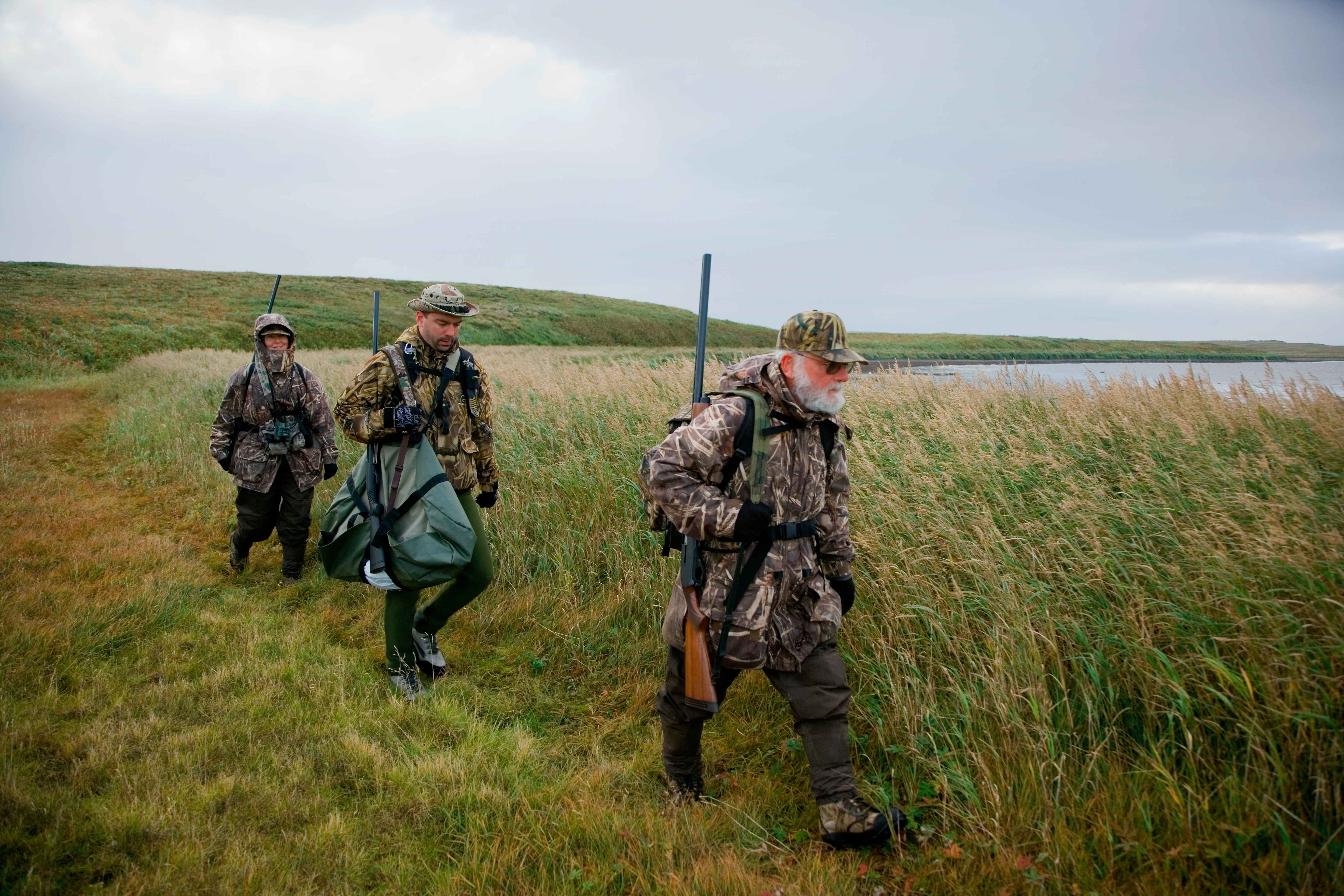 Group_of_duck_hunters_on_lake.jpg