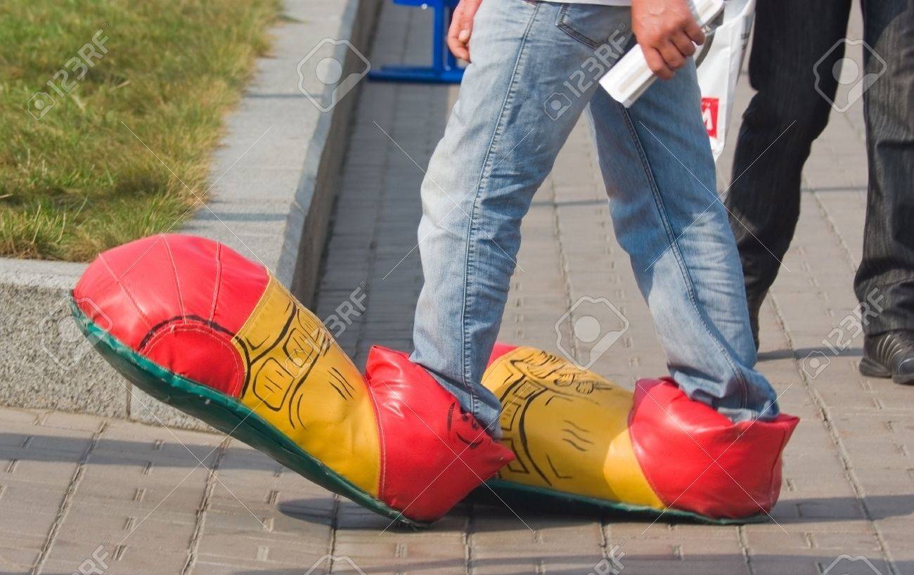 5941496-pedestrian-on-the-street-in-clown-shoes-Stock-Photo-awkward.jpg