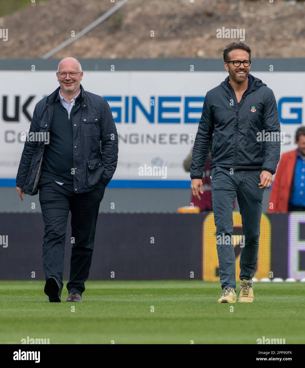 wrexham-wrexham-county-borough-wales-22nd-april-2023-co-owner-ryan-reynolds-and-shaun-harvey-walks-across-the-pitch-ahead-of-kick-off-during-wrexham-association-football-club-v-boreham-wood-football-club-at-the-racecourse-ground-in-in-the-vanarama-national-league-credit-image-cody-froggattalamy-live-news-2PP90PX.jpg