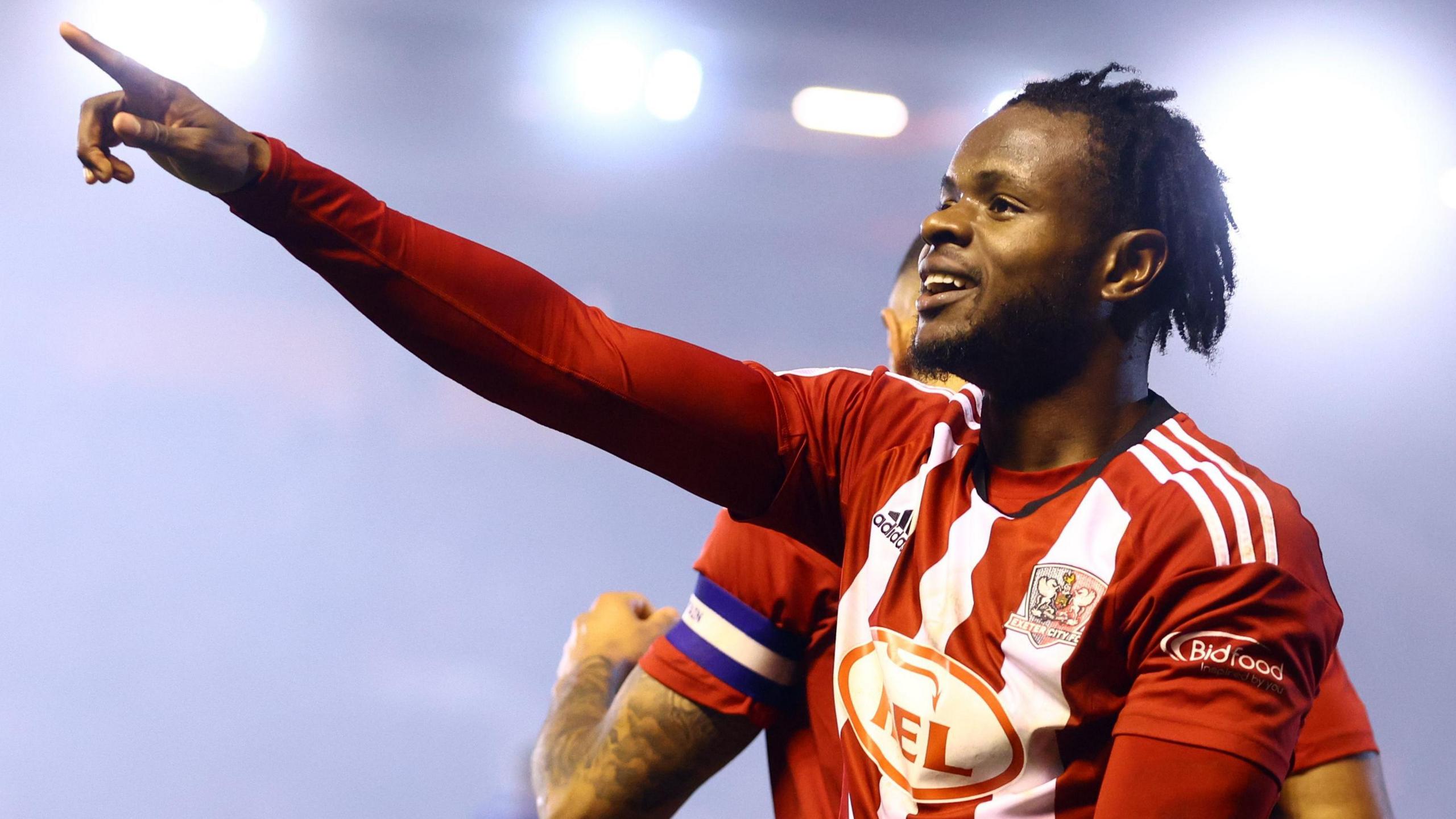 Millenic Alli celebrates scoring a goal Millenic Alli celebrates scoring a goal